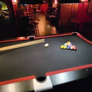 a pool table with billiards on it