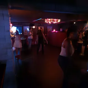 a group of people in a dimly lit room