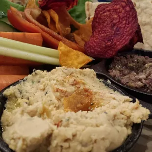 Hummus n olive tempande with veggies, pita and beet chips.