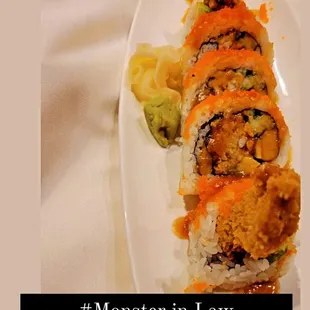 Monster in law roll, deep fried soft shell crab inside with avocado, finish with fish roe on the top.