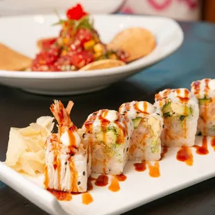 a plate of sushi and a plate of chips