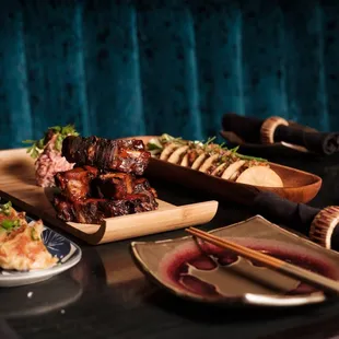 a plate of food and a glass of beer