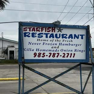 a sign in a parking lot