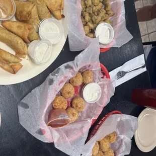 Crawfish balls, crab balls, fried okra, boudin burritos