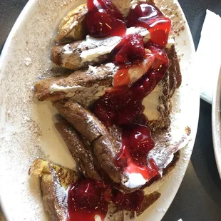French toast w butter &amp; strawberry topping.