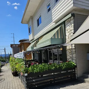 a bench with a planter on it