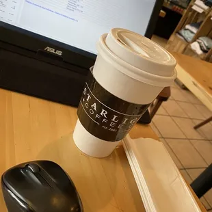 a cup of coffee and a computer mouse