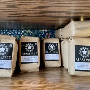 three bags of coffee on a shelf