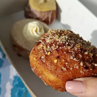Pimento doughnut in the front, eggnog and milk and cookies in the background