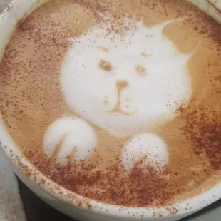Almond milk latte with cute latte art.