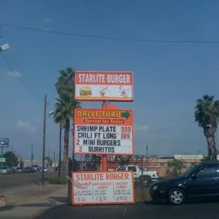 multiple signs on the side of the road