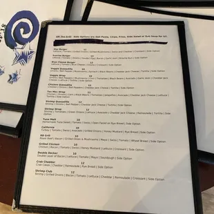 a menu and a glass of wine