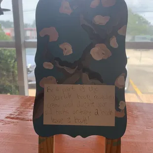 Like a little free library in Starlite! I love it so much!!