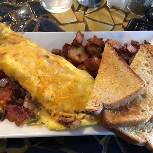 All veggie omelet with bacon and home potatoes.