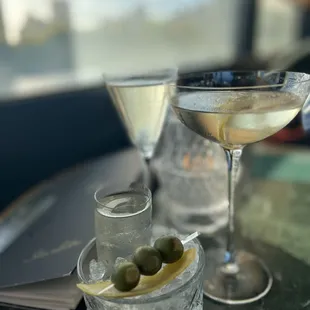 Well crafted cocktails with the martini in a smaller vessel but served with a refill