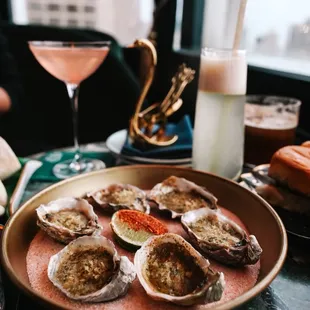 a plate of oysters and a glass of wine