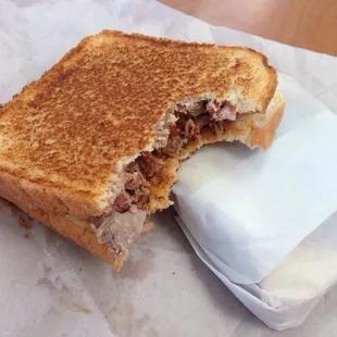The pork shown on sitting on top of the beef waiting patiently.