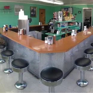 two people standing at the bar