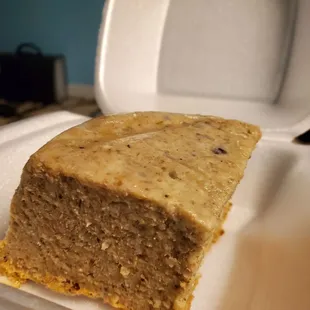 a piece of cake in a styrofoam container