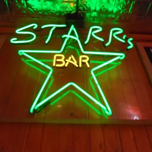 Neon sign above the front door.