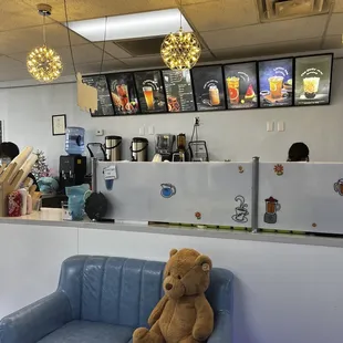 a teddy bear sitting on a blue couch