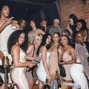 a group of women posing for a picture