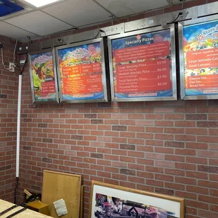 menus on a brick wall