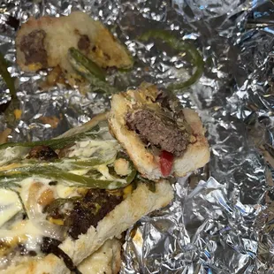 a piece of pizza on tin foil