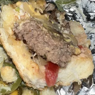 a sandwich with meat and vegetables