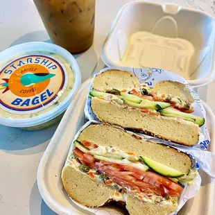 Supernova Lox with garden veggie schmear on everything bagel and an iced latte