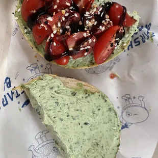 Basil cream cheese on an everything bagel