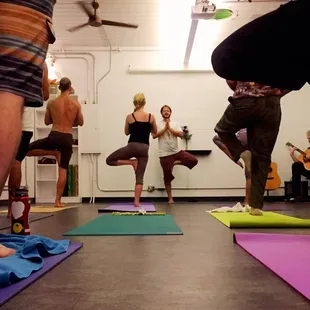 Yoga class does tree pose