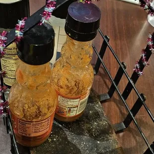 two jars of sauce on a tray