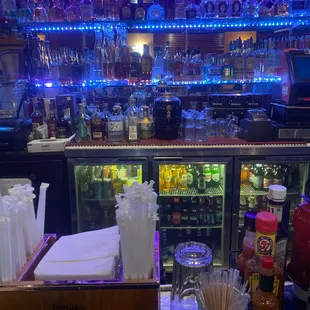 a bar with a variety of drinks