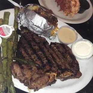 Porterhouse Dinner loaded Baked Potato and a lobster tail ..