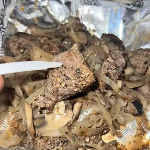 Starter&apos;s Famous Steak Bites with onions and mushrooms