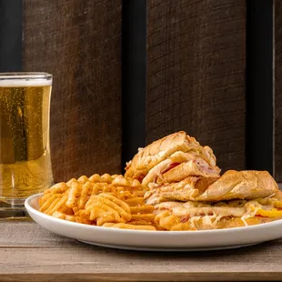 a plate of food and a glass of beer