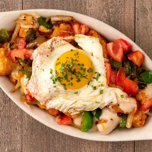 a plate of food with a fried egg on top