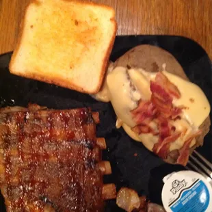 Half a rack of ribs, loaded baked potato, and toast. I also hada salad. It was 13.95.