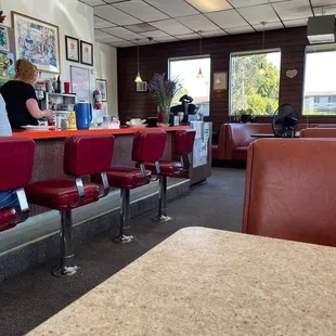 a woman sitting at the counter