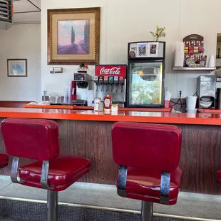 red chairs at the counter