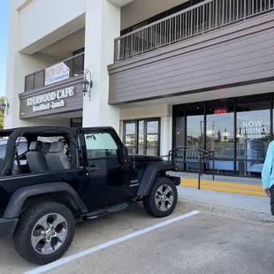 Located facing Arapaho, across the street from the Catholic Church, set back behind Andy's Frozen Custard.