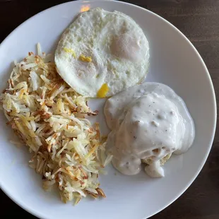 2 eggs over easy, hash browns and biscuit and gravy
