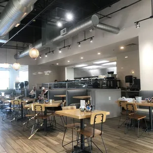 The sunny and spacious interior features lots of lovely details, like crystal globe pendant lights.