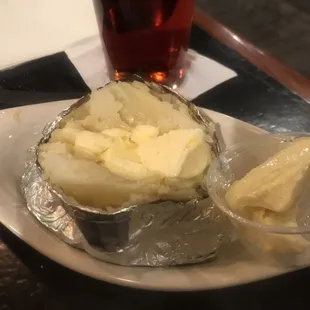 Steaming hot baked potato. Extra butter. Fluffy, really great