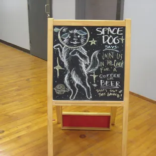 a chalkboard with a cat on it