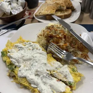 Ultimate Greek omelette added Taziki for extra flavor and potatoes