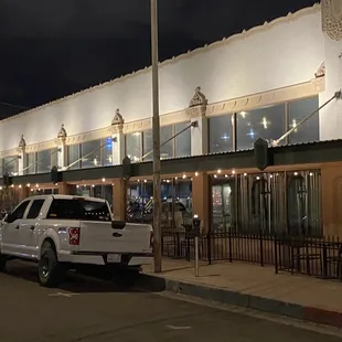 a white truck parked in front of a building