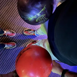 a person holding a bowling ball