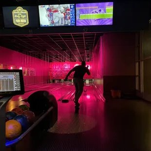 a man playing bowling